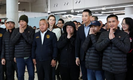 Thailand’s foreign minister Maris Sangyampong with the five freed Thai hostages at Bangkok’s Suvarnabhumi airport, 9 February 2025.