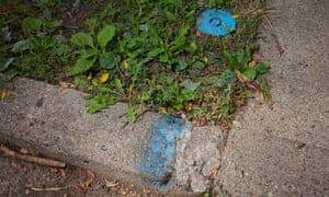 The Detroit water and sewerage department marks the curb in front of houses whose water it has shut off, including this house in Detroit’s North End neighborhood.