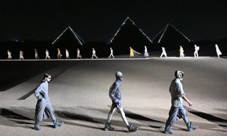 Models walk the runway in front of the Giza Pyramids during the Dior Menswear show.
