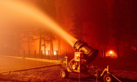 A snow blower sprays water at the Sierra-at-Tahoe Resort during the Caldor fire.