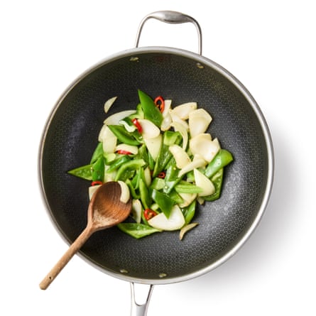 Heat a tablespoon of neutral oil in a wok until smoking, then stir-fry the onion, pepper and chilli until softened.