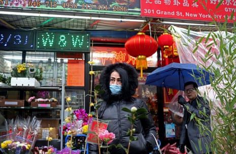 A woman wears a face mask in New York City’s Chinatown on 13 February. 