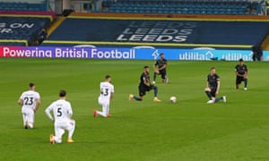 The players take a knee in support of Black Lives Matter.
