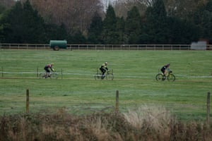 The 60-64 category cross a field, part of the course at the Trinity Park Showground.