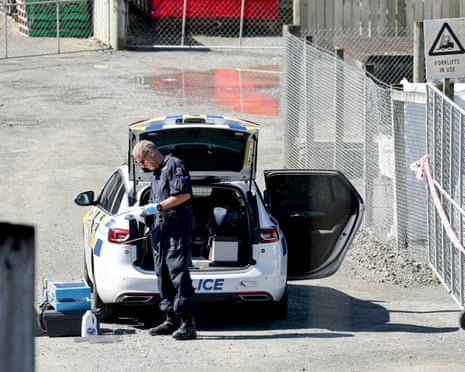 A police officer investigates at the site after the shootout