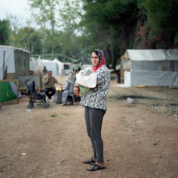 Ritsona, Chalkida, Greece 2016 Misgin Abdulah, a 33-year-old mother of three, poses with her eight-day-old baby.
