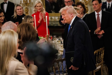 President Donald Trump arrives for a Kennedy Center board dinner in the state dining room of the White House in Washington DC.