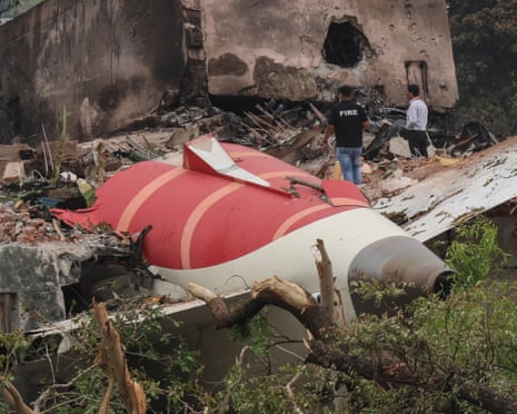 Officials inspect the site of the crash