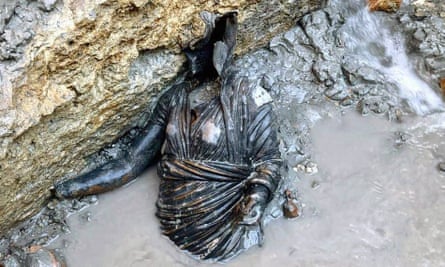 Along with the bronzes more than 6,000 coins were found along with numerous votives, including small figurines.