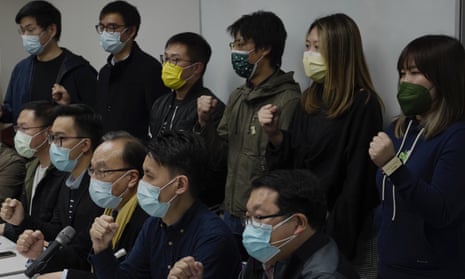 Pro-democratic party members hold a press conference in response to mass arrests in Hong Kong.