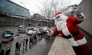 A masked Santa Claus welcomes people to a vaccination centre in Brussels, Belgium.