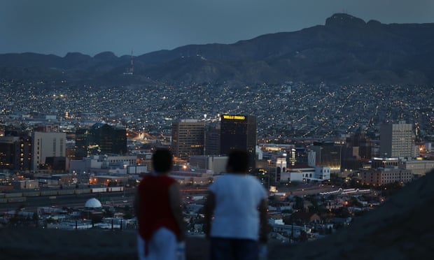 People look out at the lights of El Paso and Ciudad Juárez, Mexico.