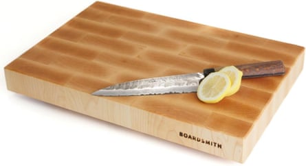 a cutting board with a knife and slices of lemon