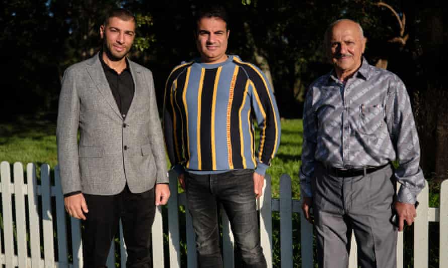 Talal Taha, Kahoder Sabra and their relative pose for a photo before Eid ul Fitr prayers at Parramatta Park in western Sydney, 2022