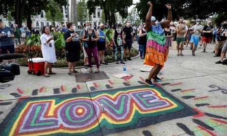 Kenosha marches on as protesters describe 'kidnap' by federal agents | Wisconsin 6 A woman reacts at a vigil, following the police shooting of Jacob Blake, on Friday.