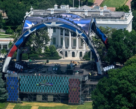 Workers continue building the stage for a future UFC fight on the South Lawn of the White House on Sunday.