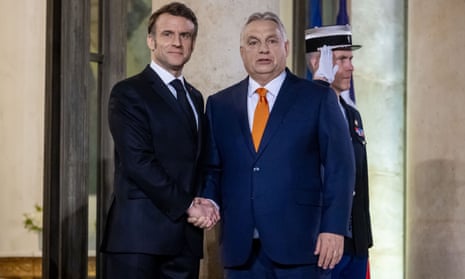 French President Emmanuel Macron (L) welcomes Hungary's prime minister Viktor Orbán (R) prior to a working dinner at Élysée Palace in Paris.