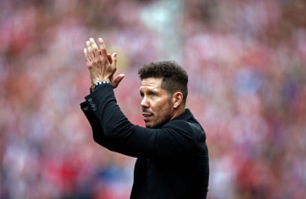 Diego Simeone greets the fans at the Vicente Calderón stadium.