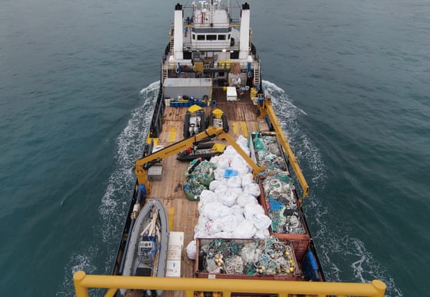 Over 47 tons of plastic found at US marine reserve – and an entangled seal The M/V Imua, 180ft supply vessel, as it steams into port in Honolulu carrying 94,472lb of marine debris on deck. Photograph: David Golden