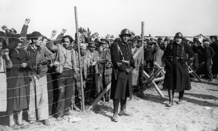 Spanish refugees, mainly republicans and members of the international brigades, guarded by French troops at a camp on Argeles beach in 1939.