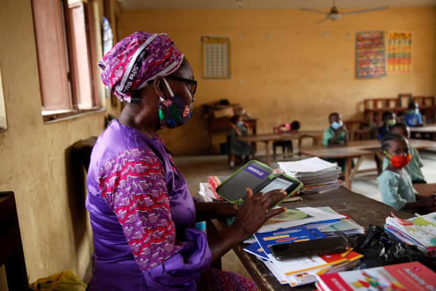 Teacher Grace Olowoje calls the register during an open day at the Dairy Farm primary school in the Agege district of Lagos, Nigeria, on 22 January 2021.