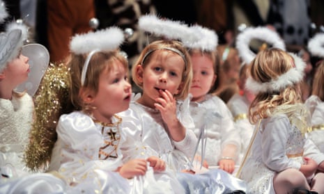 Children dressed as angels performing in a primary school nativity play