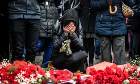 Mourners at the site of explosions near a football stadium in Istanbul that killed 44 people on Tuesday.