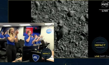 Scientists react as Nasa successfully crashes spacecraft into an asteroid.