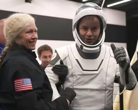 Russian cosmonaut Oleg Platonov being helped out of the capsule