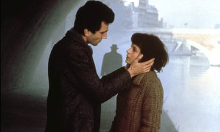 Daniel Day-Lewis holding Juliette Binoche's face as they look intently into each other's eyes