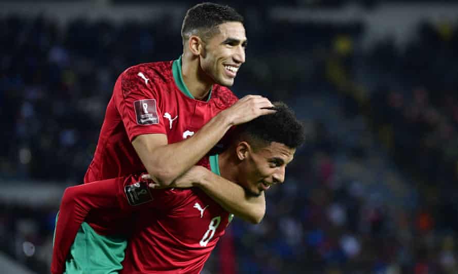 Morocco’s midfielder Azzedine Ounahi celebrates with teammate Achraf Hakimi.