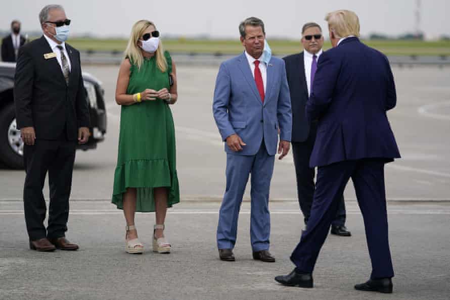 Donald TrumpGeorgia Governor Brian Kemp, third from left, greets Donald Trump at Hartsfield-Jackson International Airport in Atlanta this afternoon.