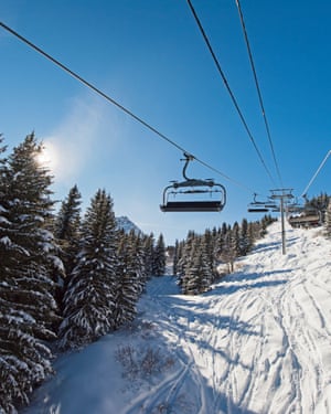 'I can barely look ahead to the primary snows to fall': why I really feel so alive after I ski | Come house to the slopes 4 Traveling up an alpine mountainside on ski chair liftPanoramic view of a snow covered alpine mountain range while traveling up on chairlift ski lift in sunlight