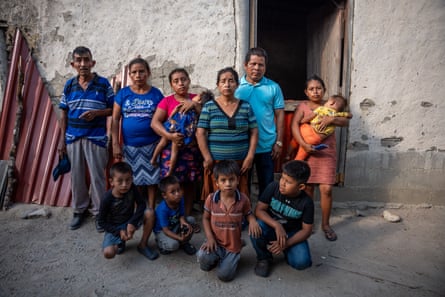 A family in Honduras outside their home