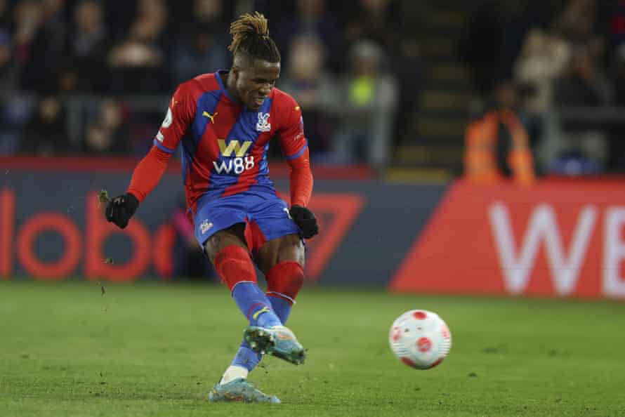 Crystal Palace’s Wilfried Zaha scores a penalty, his side’s third goal.