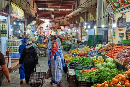 market stalls with food in the narrow alleys in old town (medina) of Fez, Morocco