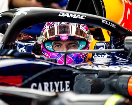 Max Verstappen in his helmet, waiting for a practice lap.