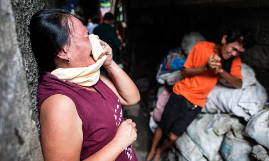The grieving parents of a suspected drug user killed by the police in Manila, Philippines. More than 3000 people have died in a bloody three-months-old war on crime.