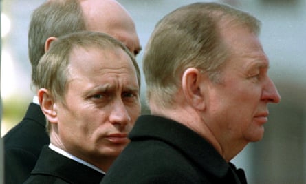 Vladimir Putin with Leonid Kuchma at a commemorative service, 1990s