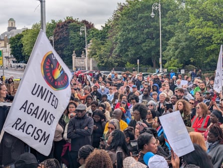 People taking part in a protest outside Leinster House, Dublin.
