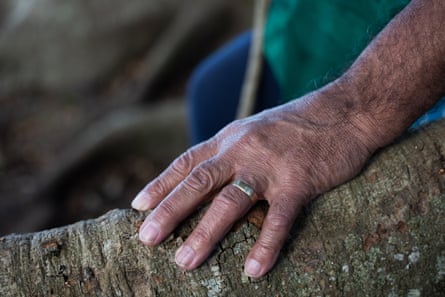 Uncle Bobby ‘Bullfrog’ Young rests his hand on the roots of the fig tree where the boys used to be chained up as punishment.