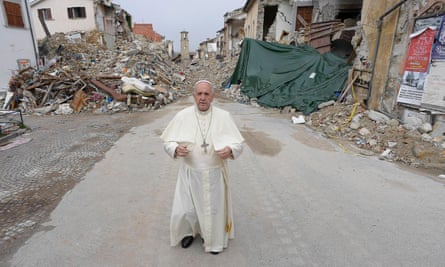 Pope Francis praying in the ruins of a devastating earthquake in Amatrice, Italy, in 2016.