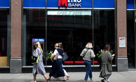 People walk past a Metro Bank in London.