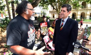 Adrian Burragubba of the Wangan and Jagalingou people talks to Queensland’s Speaker, Peter Wellington, outside Parliament House in Brisbane