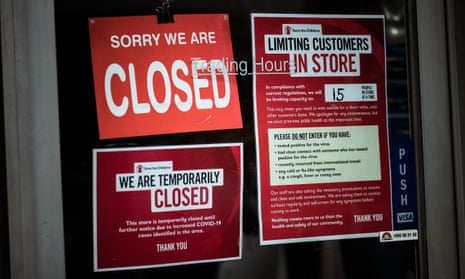 Shops on in Melbourne’s Brunswick display signs informing customers of their closure on 5 August.