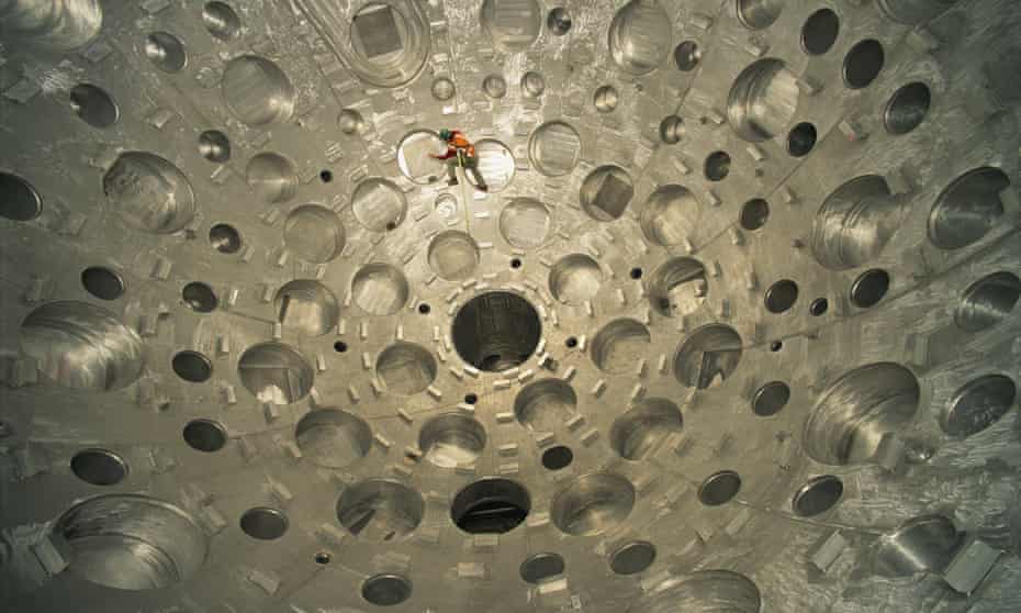 Physicist Vaughn Draggoo inspects the target chamber during its construction at the National Ignition Facility in Livermore, California, October 2001.