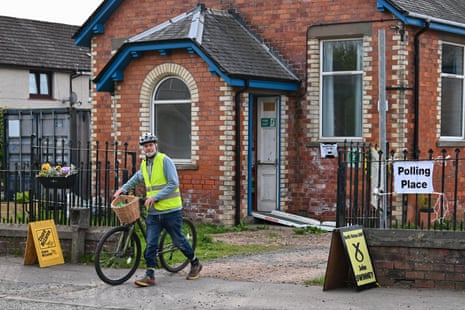 A man leaving a polling station in Burrelton, Perthshire, Scotland this morning.