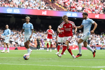 Martin Ødegaard scores Arsenal’s third goal against Manchester City in the Community Shield.