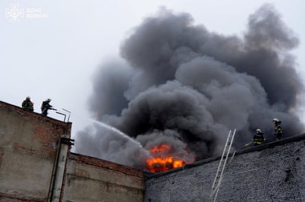 Firefighters work at the site of a Russian drone attack in Lutsk, Ukraine, on Wednesday