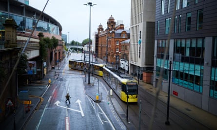 A tram in an empty-looking Manchester city centre